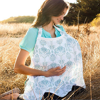 A breastfeeding woman with a nursing cloth covering the baby