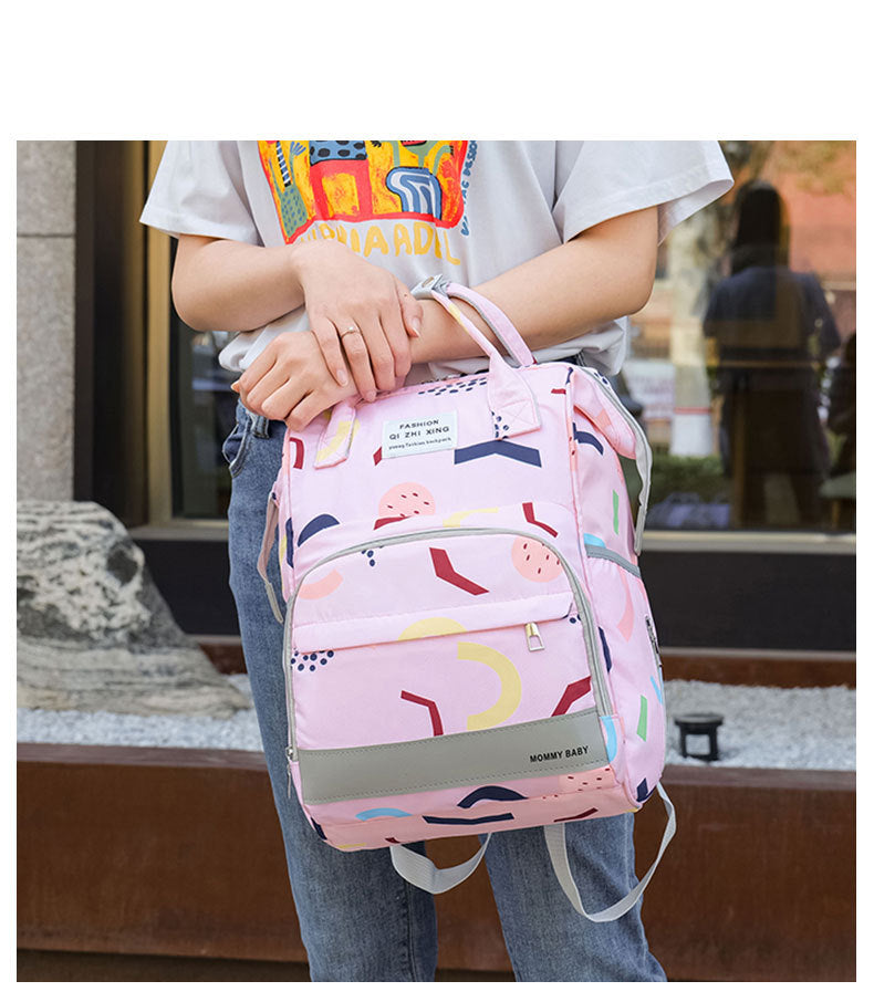 Women hold teh Multi-compartment Mummy Bag Large Capacity Portable Backpack Baby Diaper Bag